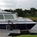 A tour boat called Jacobite Rebel anchored at the dock
